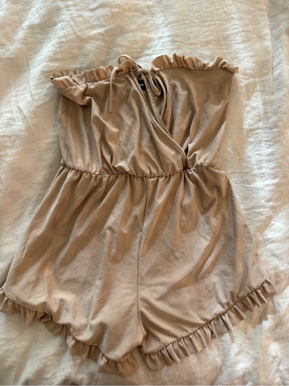 PrettyLittleThing Beige Ruffle Strapless One-Piece Romper